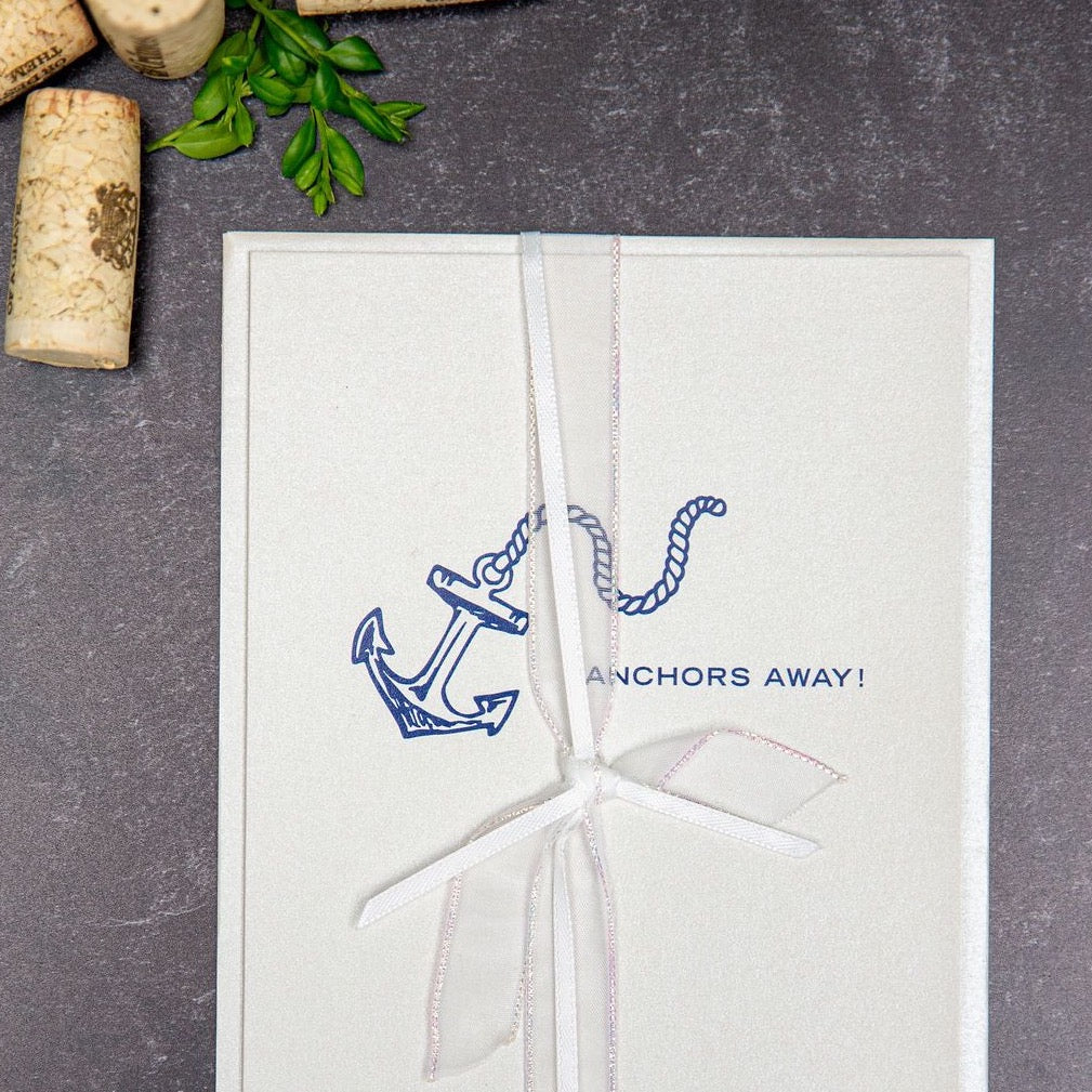 Illustrated anchor and rope with "anchors away!" on metallic silver paper and white bridal ribbon