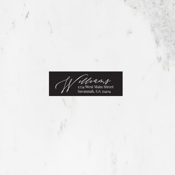 Rectangle address sticker in black with modern script font.