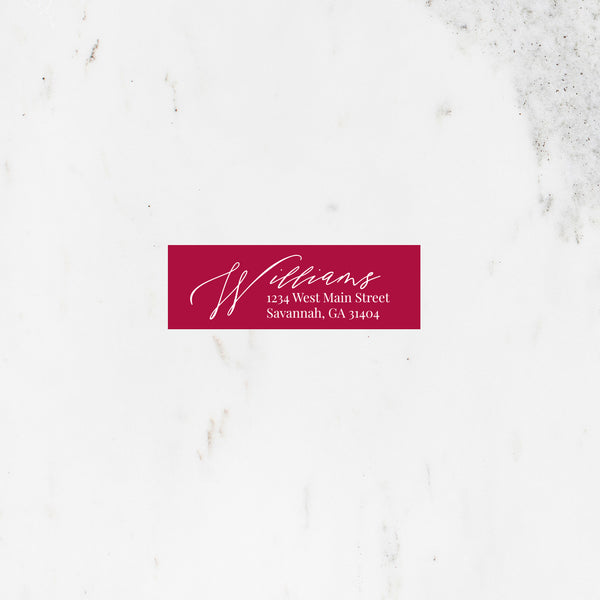 Rectangle address sticker in red with modern script font.