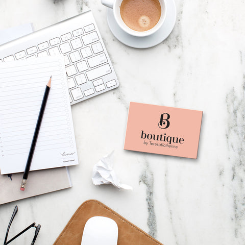 boutique gift card on marble desk with latte and desk accessories