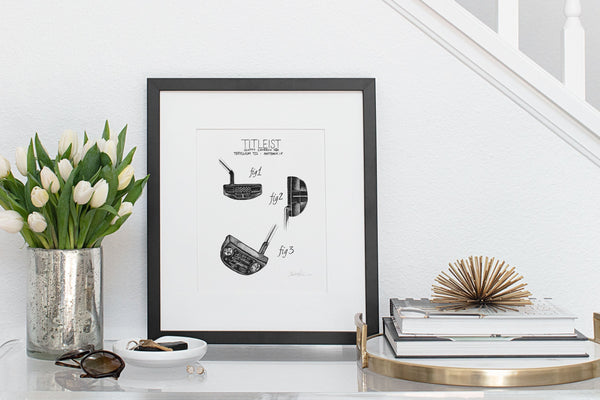 3 views of Titleist Scotty Cameron Terlyllium T22 Fastback 1.5 putter print in simple black frame on clear entryway table.