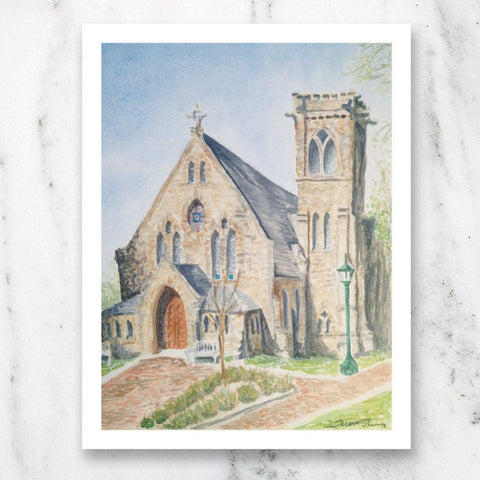 watercolor print of University of Virginia Chapel on marble table top